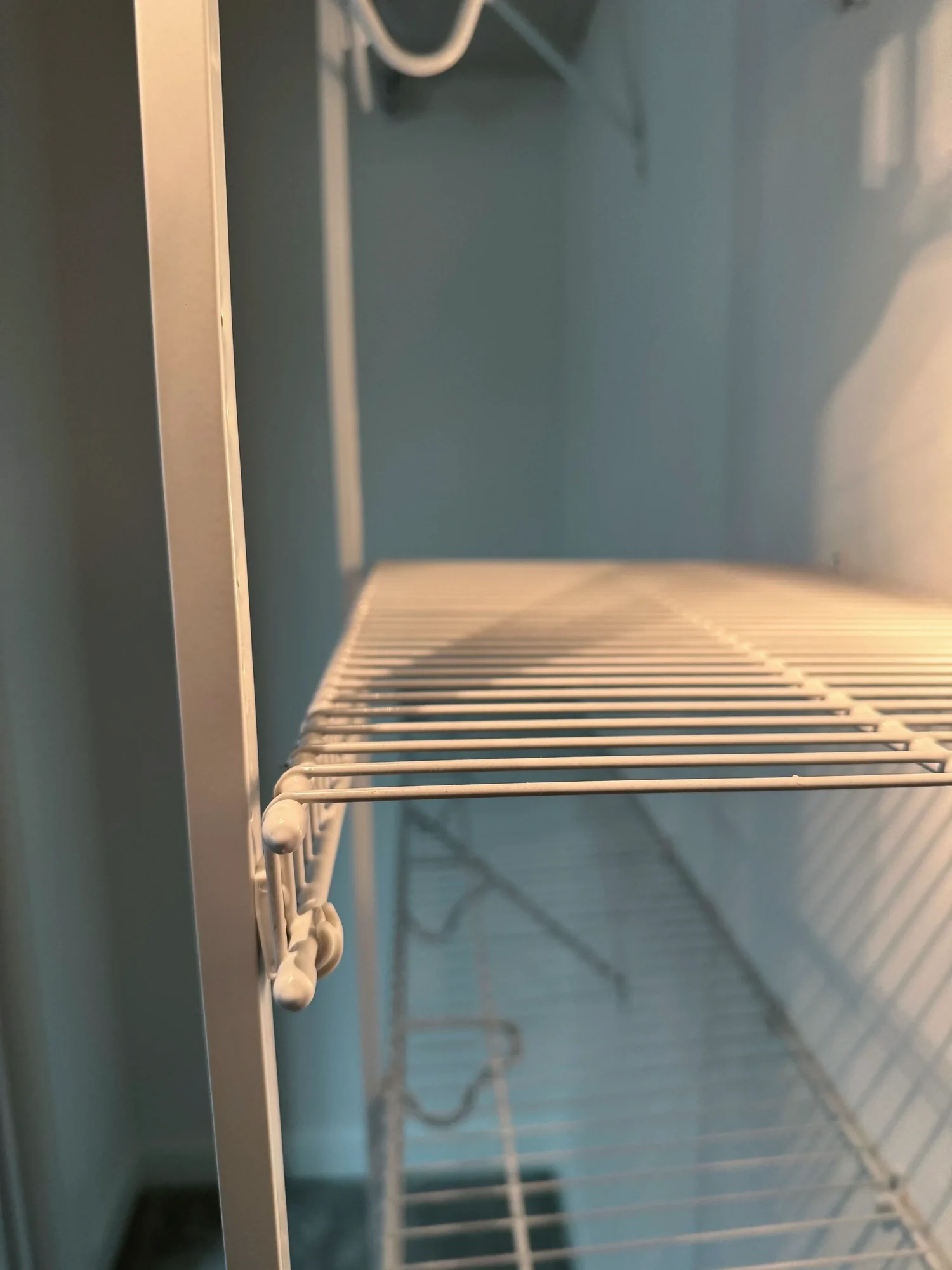 Close view of a wire shelf at the edge of a closet