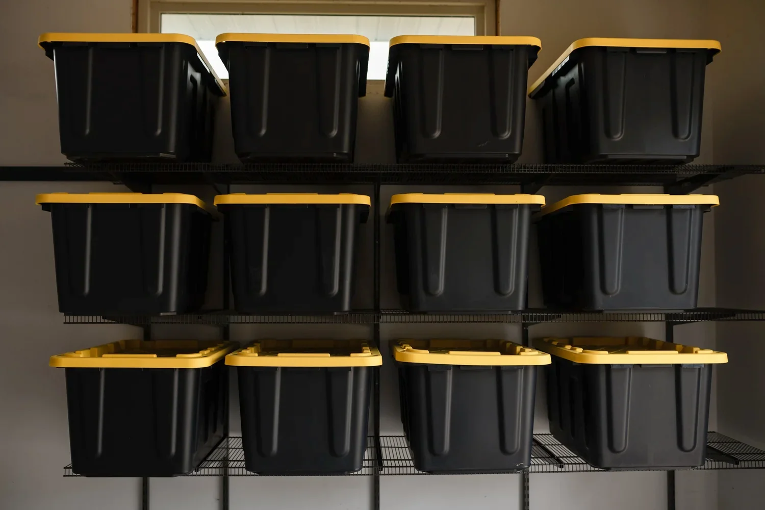 Close view of storage bins lined up on gunmetal wire shelves